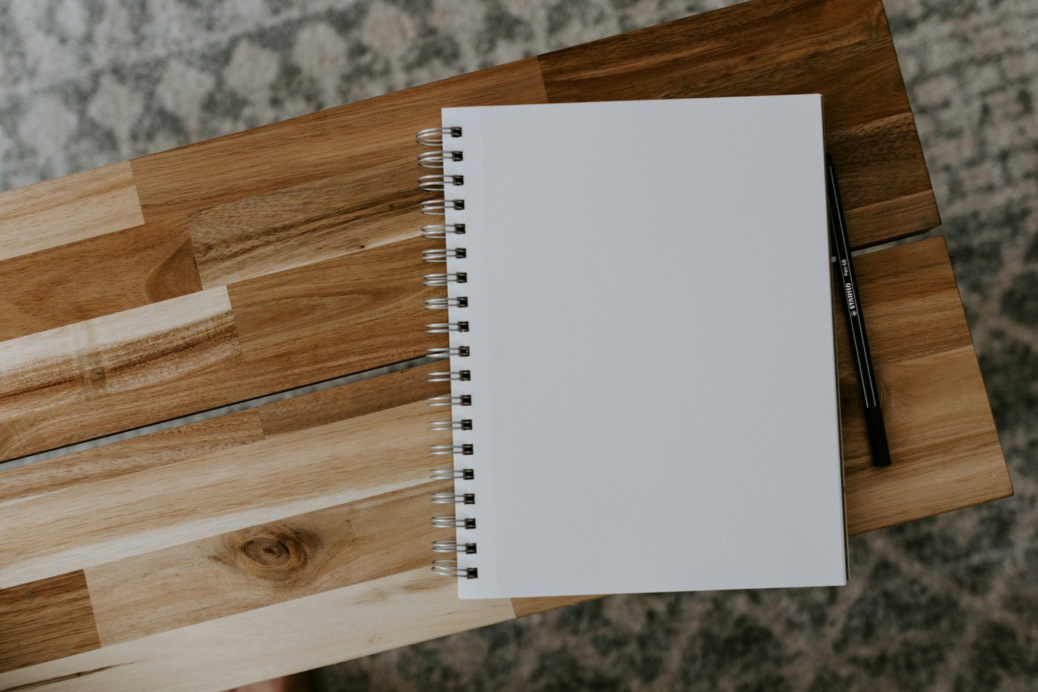 Event planning notebook on wooden surface